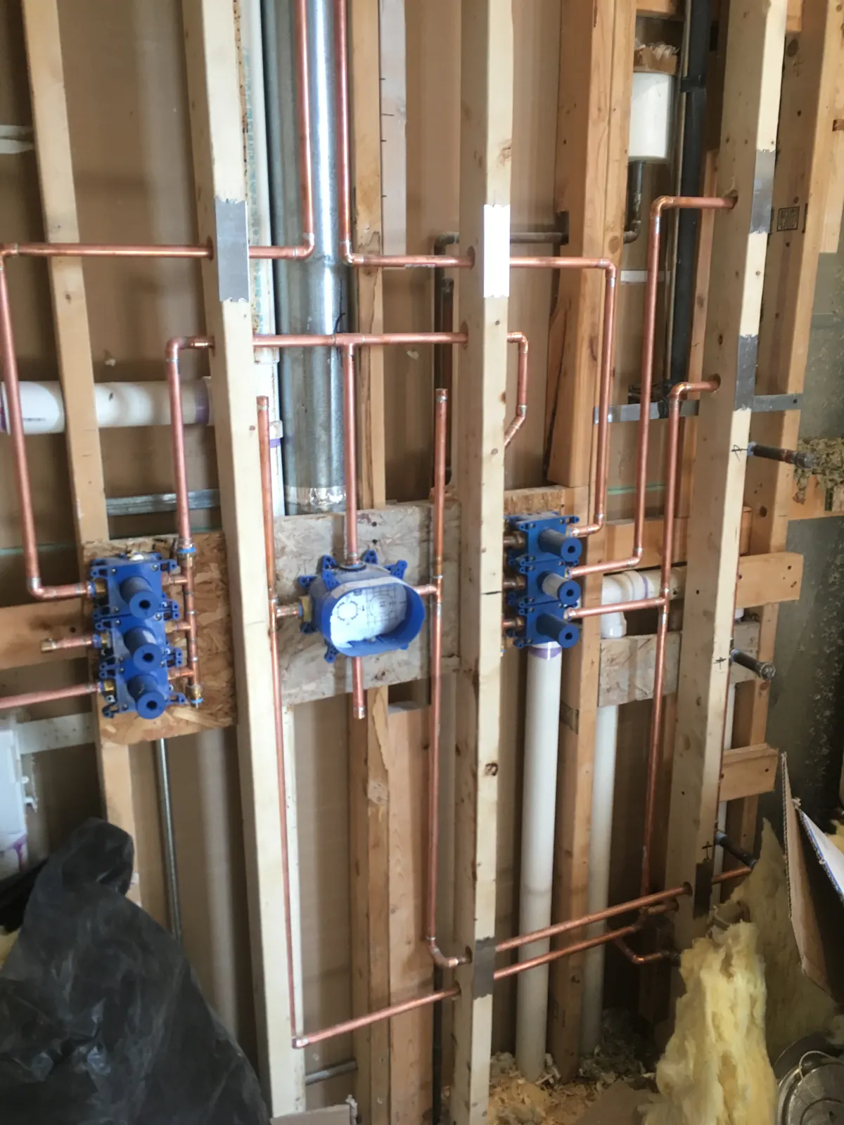 Copper manifold rough-in with pressure balancing valves by Power Plumbing