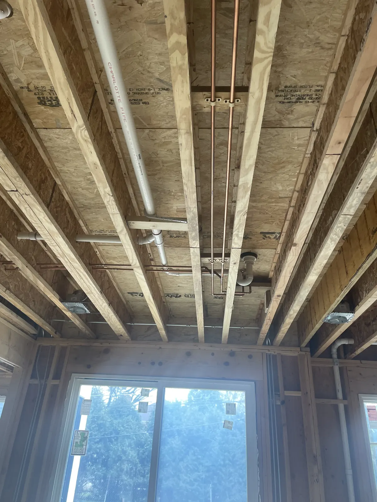 Overhead copper water line distribution installed by Power Plumbing