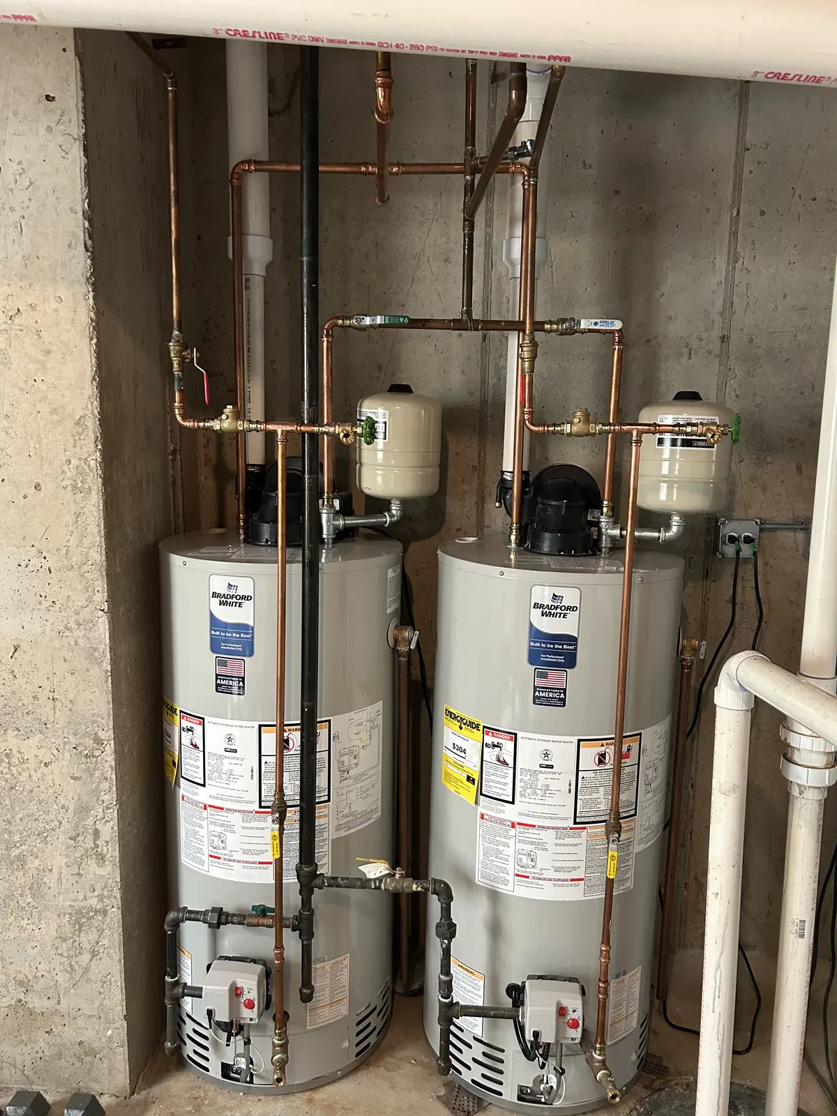 Double water heater installation with copper piping by Power Plumbing
