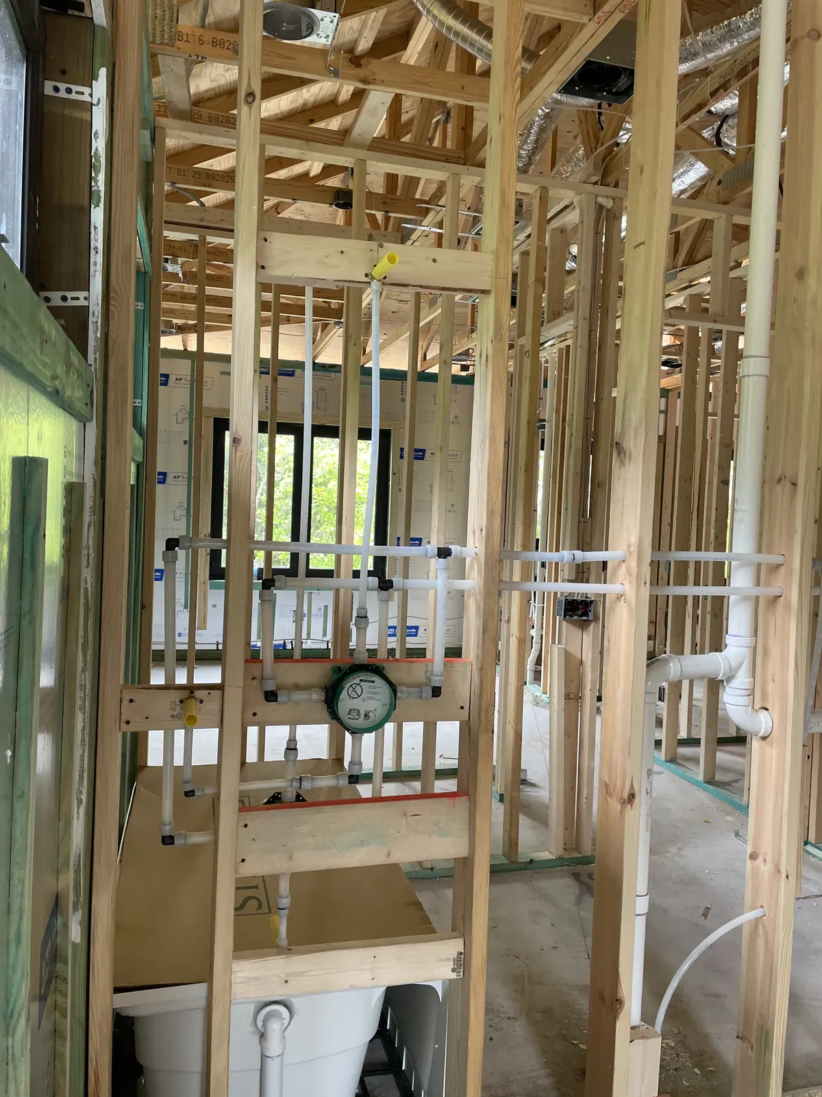 Rough-in plumbing in framed custom home by Power Plumbing